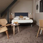 Room with breakfast tray illustrating the Best Rate Guarantee Offer at Hôtel Antares & Spa Honfleur